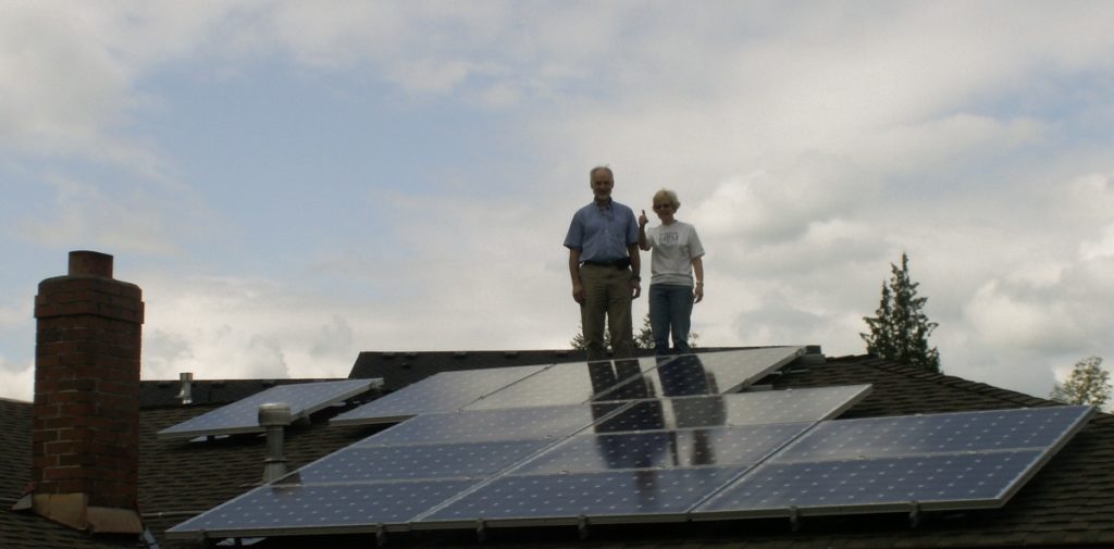 Clients Posing By Solar Array