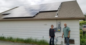 Grid Tie Solar Clients Pose with Their System